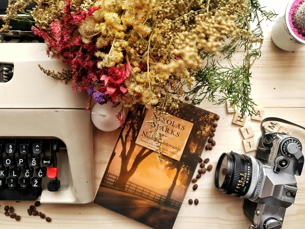 image of flowers, cup of tea and book