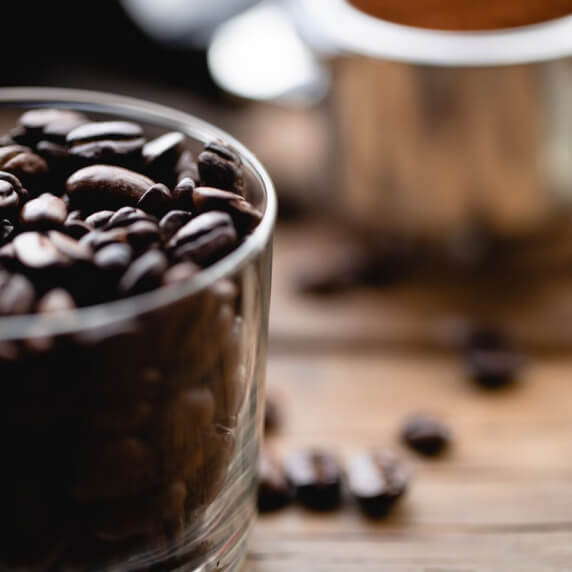 Image of cup full of coffee beans