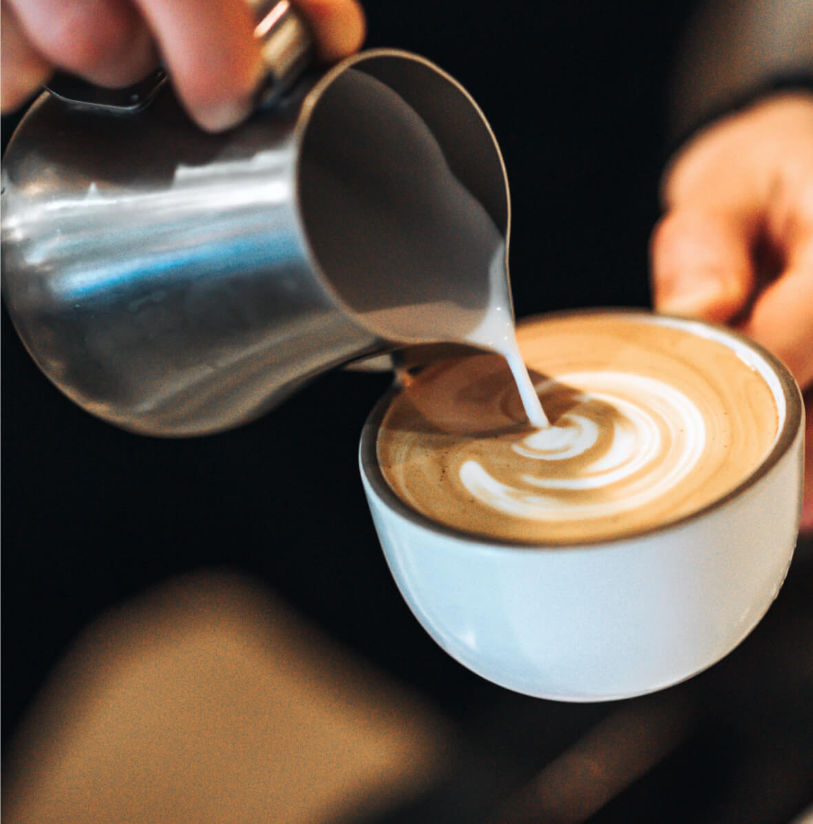 Image of latte preparation and decorated by milk