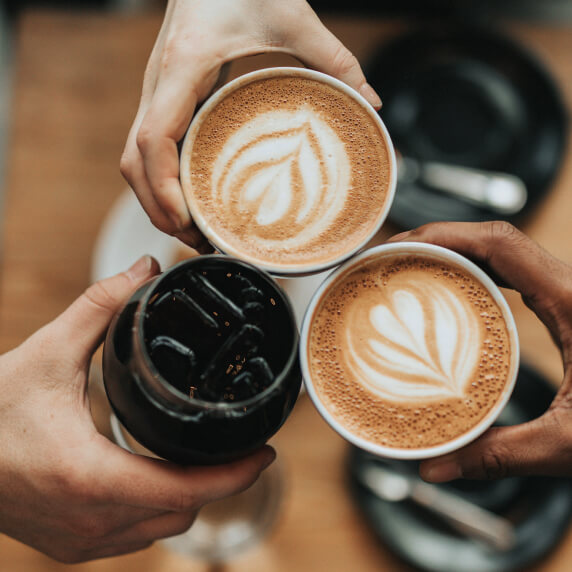 Image of three cups of different coffee decorated